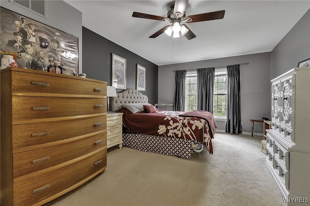carpeted bedroom with a ceiling fan
