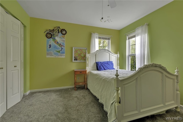 bedroom with carpet flooring, baseboards, and a ceiling fan