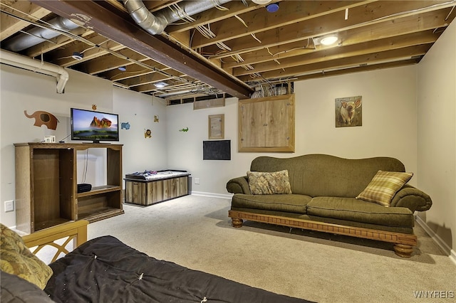 carpeted living area featuring baseboards