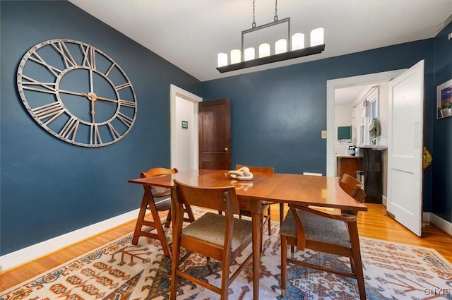dining room with wood finished floors and baseboards