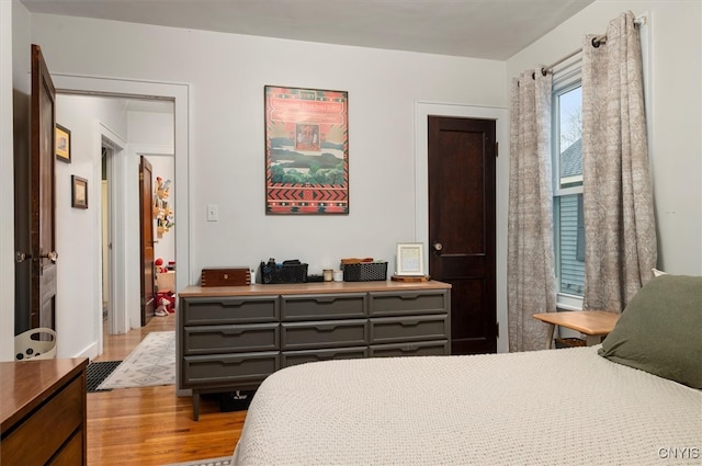 bedroom with wood finished floors