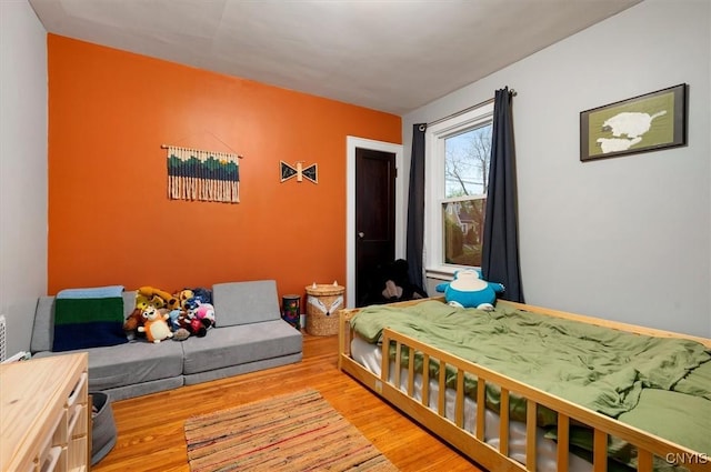 bedroom featuring wood finished floors