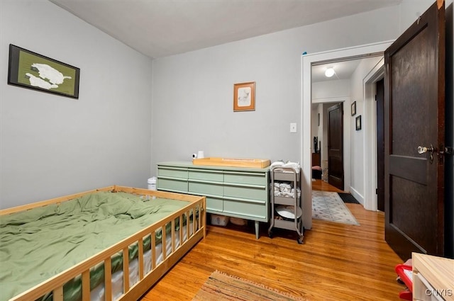 bedroom featuring light wood-style floors