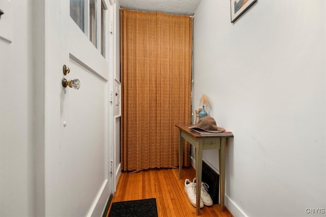 doorway to outside featuring wood finished floors