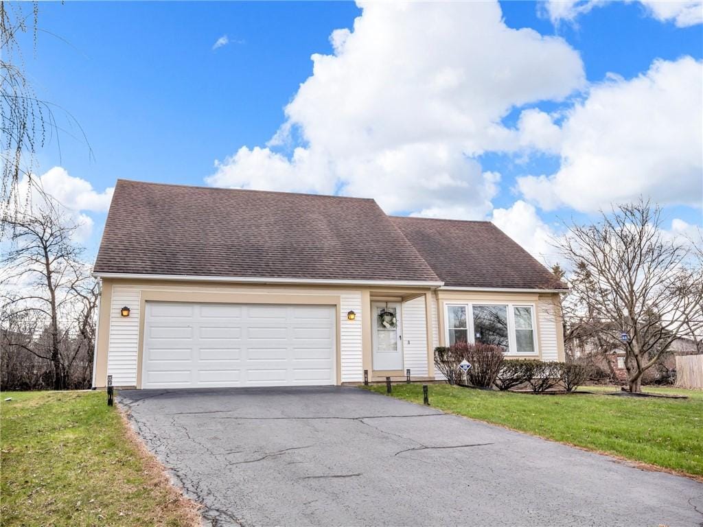29 French Meadow Ln, Brighton, NY 14618 - cape cod home with driveway, an attached garage, a front lawn, and roof with shingles