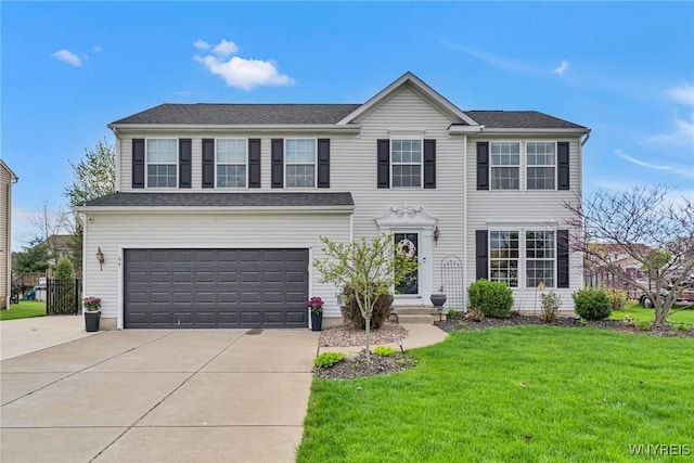 view of front of property with a garage, a front lawn, and concrete driveway
