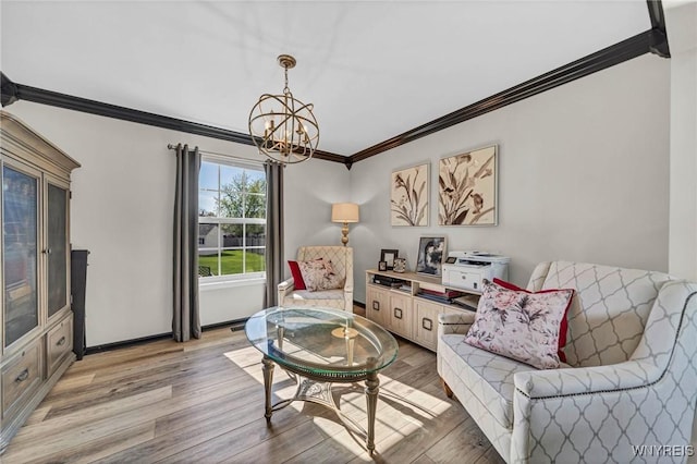 living area featuring ornamental molding, light wood finished floors, a chandelier, and baseboards