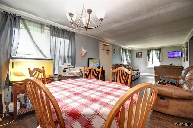 226 Parkhurst Blvd, Tonawanda-Town, NY 14223 - dining area with a chandelier, wood finished floors, and crown molding