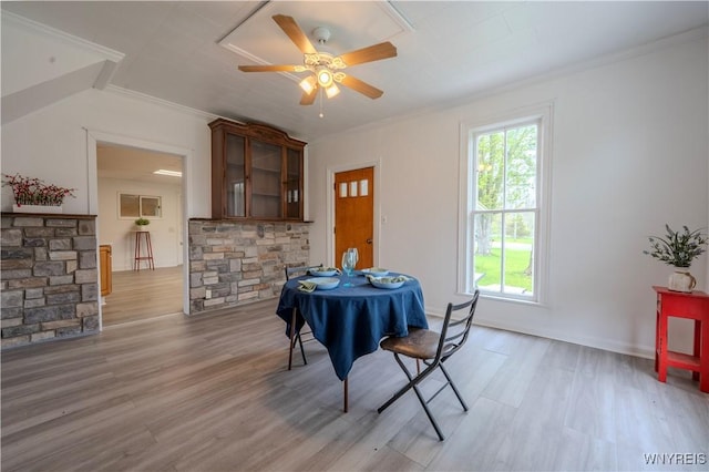6043 Old Niagara Rd, Lockport Town, NY 14094 - dining area featuring healthy amount of natural light, crown molding, light wood finished floors, and ceiling fan