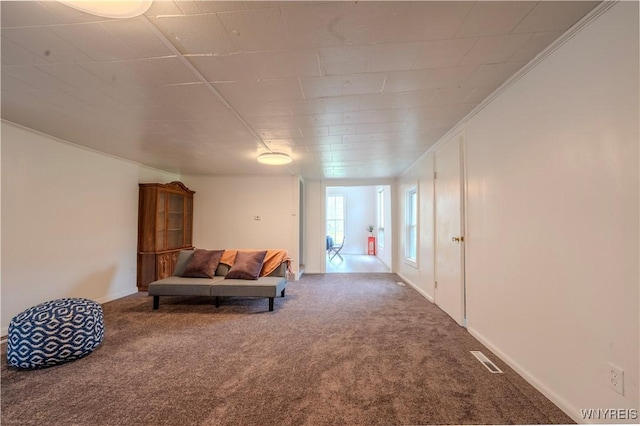 6043 Old Niagara Rd, Lockport Town, NY 14094 - living area with carpet, crown molding, and baseboards