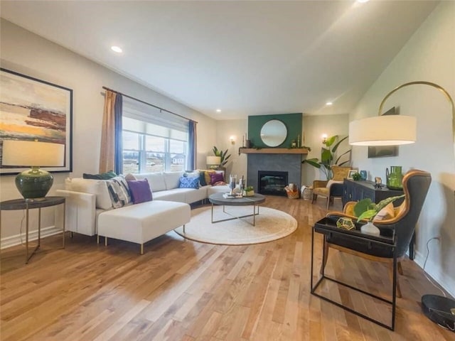 160 Jade Creek Dr, Greece, NY 14468 - living area featuring light wood-style flooring, a glass covered fireplace, and recessed lighting