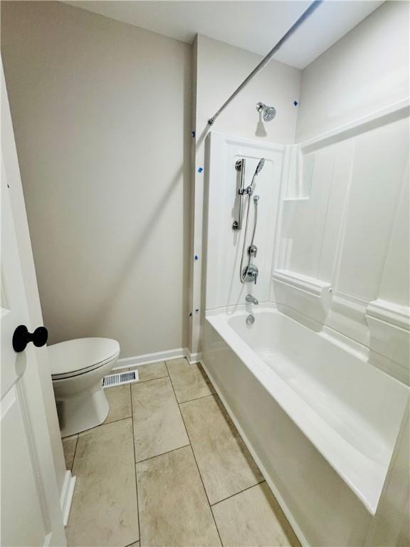 160 Jade Creek Dr, Greece, NY 14468 - full bath with toilet, tub / shower combination, tile patterned flooring, and baseboards