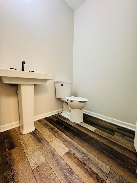 160 Jade Creek Dr, Greece, NY 14468 - bathroom featuring wood finished floors, baseboards, and toilet