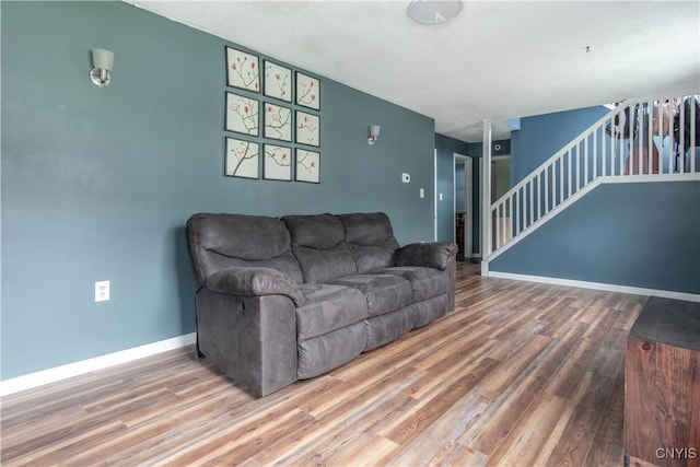 30204 County Route 179, Lyme, NY 13622 - living area with wood finished floors, stairs, and baseboards