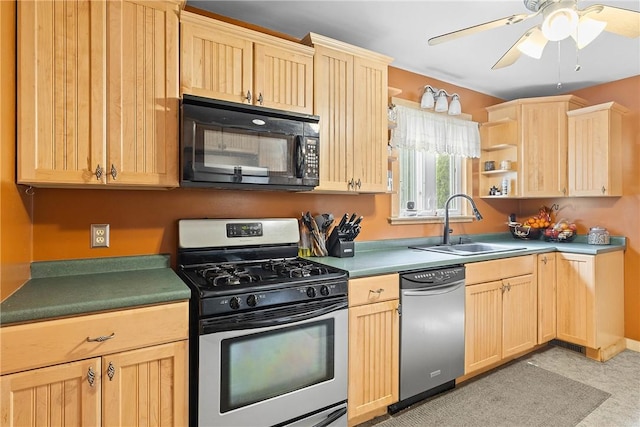 kitchen with stainless steel appliances, light brown cabinetry, and a sink