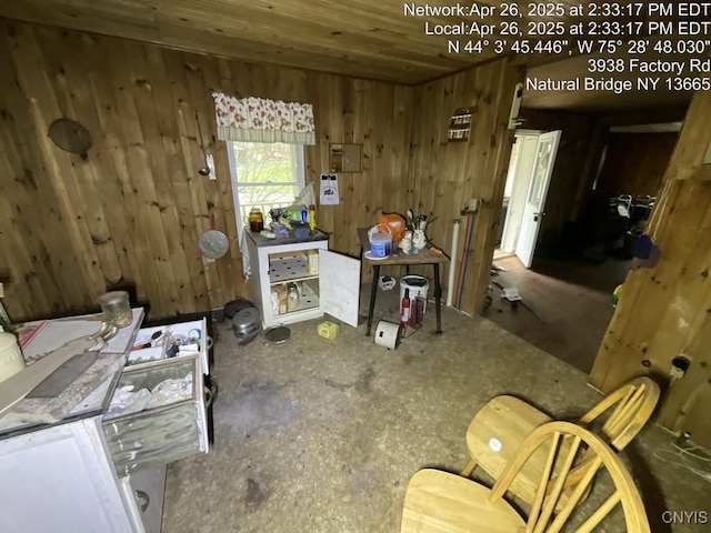 miscellaneous room featuring wooden walls