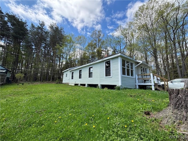 view of home's exterior with a lawn