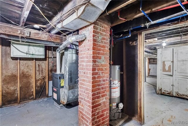 basement with water heater and heating unit