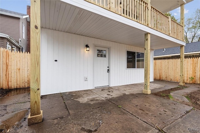 614 E Broadway St, Fulton, NY 13069 - doorway to property featuring fence, a patio, and a balcony