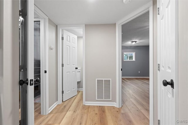 614 E Broadway St, Fulton, NY 13069 - hallway featuring light wood-style flooring and baseboards