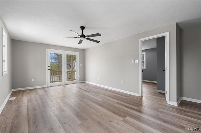 614 E Broadway St, Fulton, NY 13069 - empty room with a ceiling fan, light wood-style floors, and baseboards