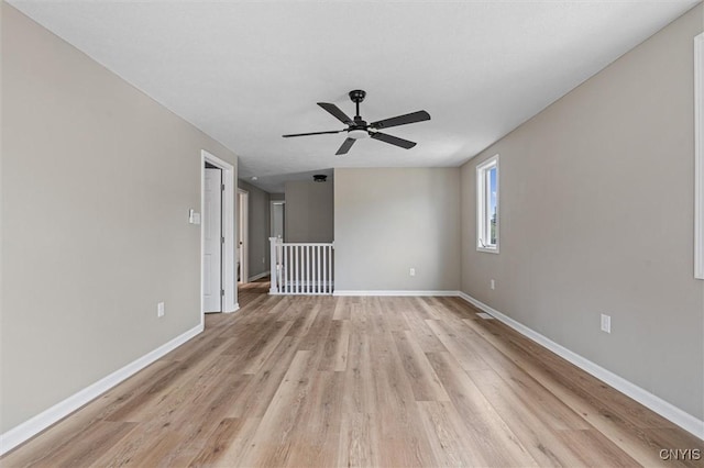 614 E Broadway St, Fulton, NY 13069 - unfurnished room with a ceiling fan, light wood-style flooring, and baseboards