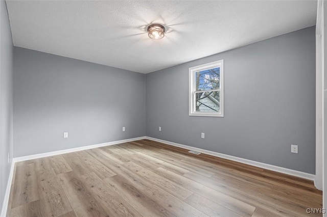 614 E Broadway St, Fulton, NY 13069 - spare room featuring wood finished floors and baseboards