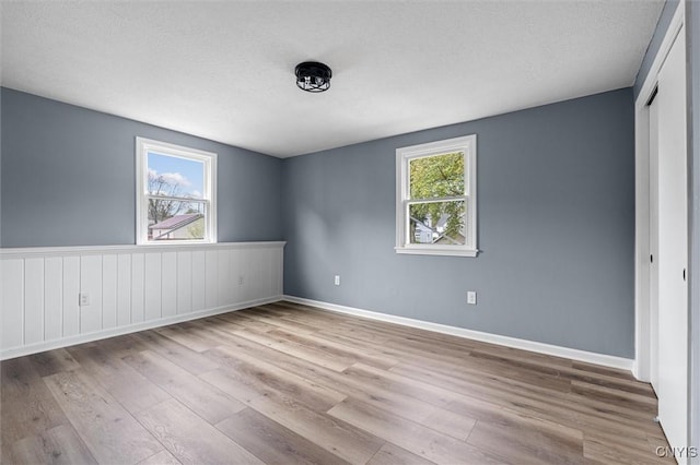 614 E Broadway St, Fulton, NY 13069 - unfurnished bedroom with wood finished floors, baseboards, and a closet