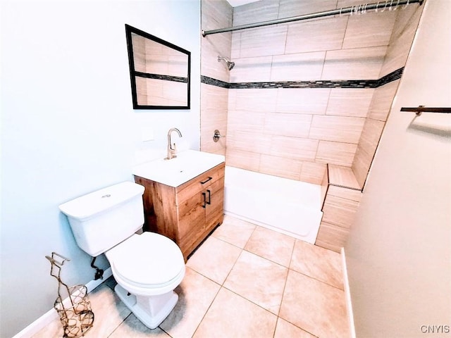 full bathroom featuring toilet, tiled shower, vanity, and tile patterned floors