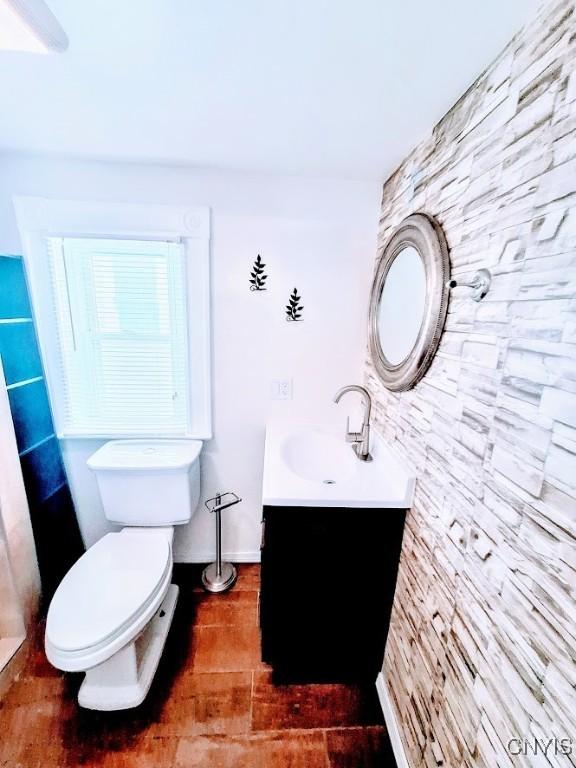 bathroom featuring vanity, toilet, and tile patterned floors