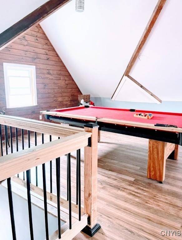 recreation room with billiards, wooden walls, lofted ceiling, and wood finished floors