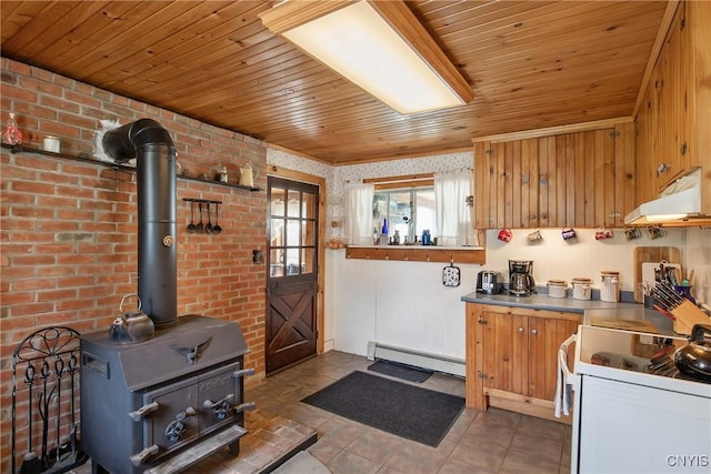 3542 Griffin Rd, Onondaga, NY 13215 - kitchen with a baseboard heating unit, white electric stove, under cabinet range hood, tile patterned flooring, and a wood stove