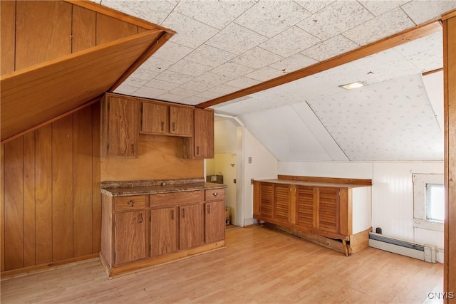 3542 Griffin Rd, Onondaga, NY 13215 - additional living space with a baseboard heating unit, lofted ceiling, light wood-style flooring, and wooden walls
