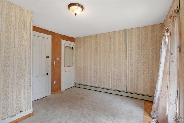 3542 Griffin Rd, Onondaga, NY 13215 - empty room with a baseboard heating unit and carpet floors