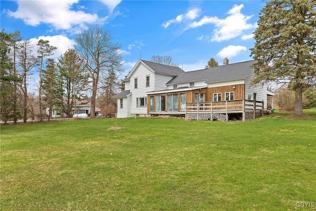 3542 Griffin Rd, Onondaga, NY 13215 - back of house featuring a chimney, a yard, and a wooden deck