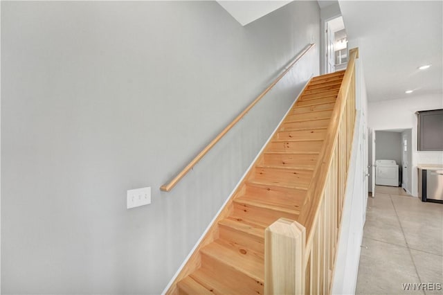 stairs with separate washer and dryer and recessed lighting