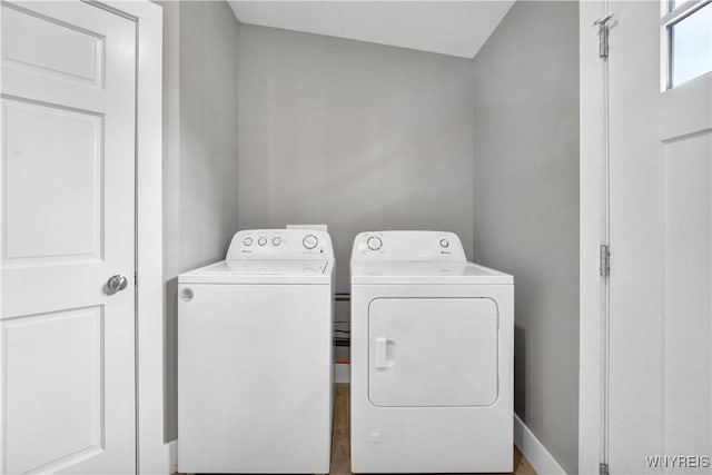laundry area with washing machine and dryer