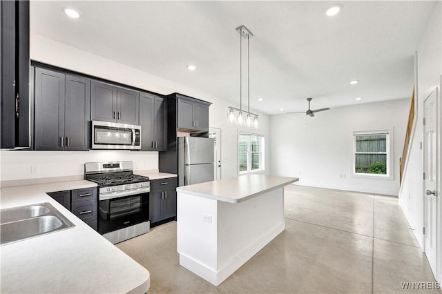 kitchen with stainless steel appliances, a ceiling fan, recessed lighting, a sink, and light countertops