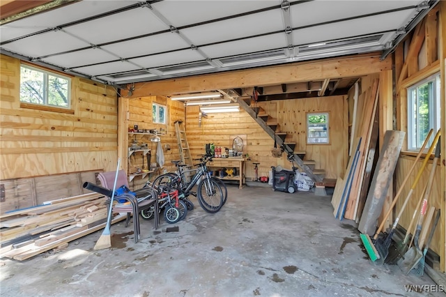 garage featuring wood walls