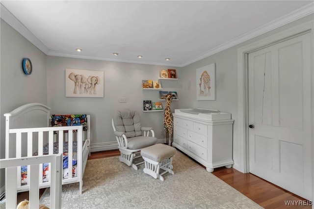bedroom with wood finished floors, a baseboard radiator, crown molding, recessed lighting, and baseboards