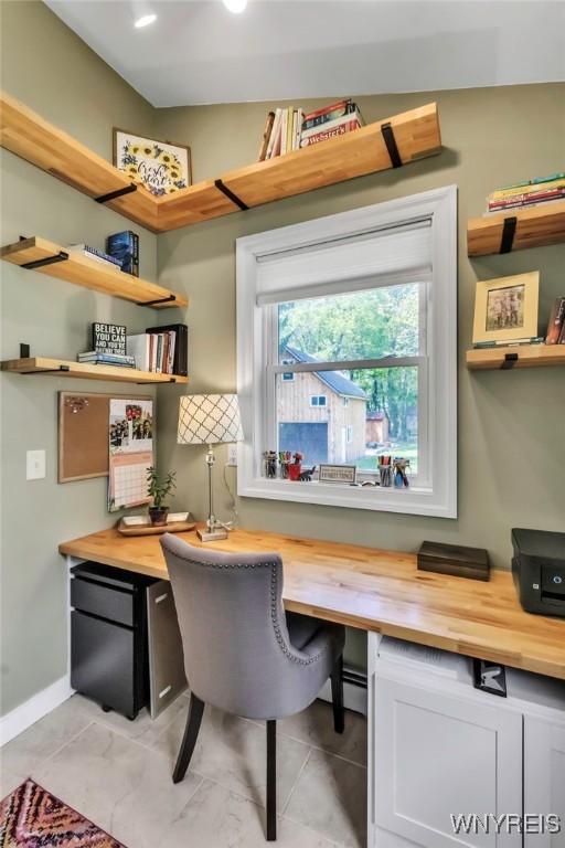 office space featuring baseboards