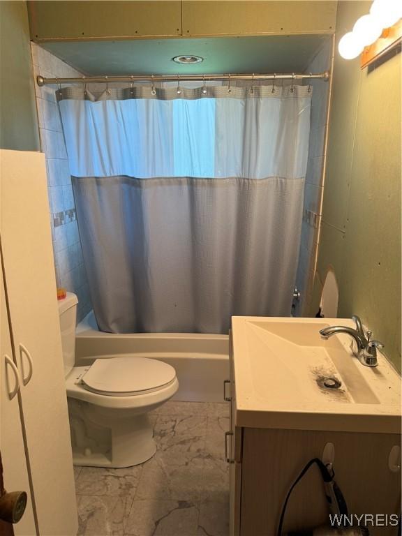 6358 Dale Rd, Newfane, NY 14108 - full bathroom with shower / tub combo with curtain, marble finish flooring, toilet, and vanity
