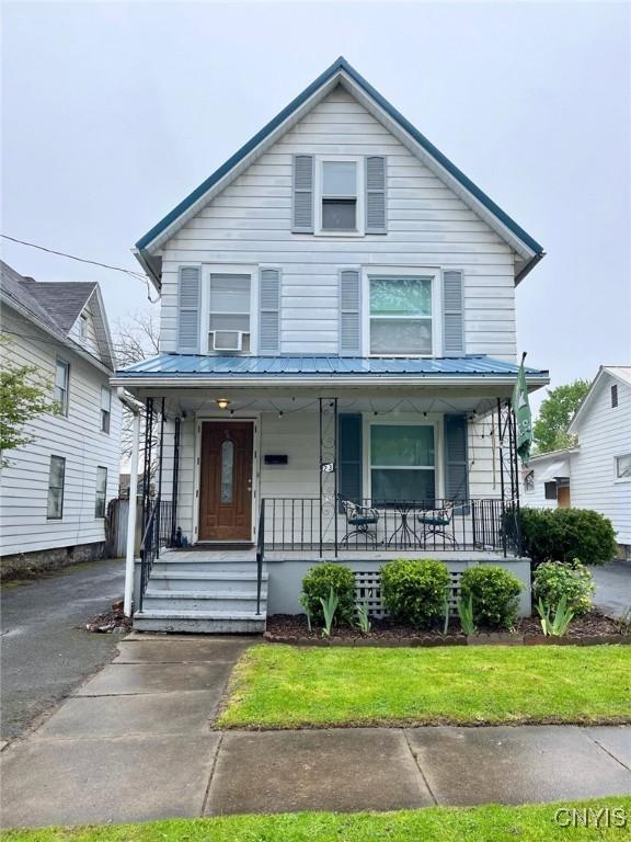 23 Paul St, Auburn, NY 13021 - traditional style home featuring covered porch and metal roof