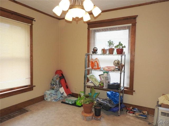 23 Paul St, Auburn, NY 13021 - playroom with crown molding, carpet flooring, and a chandelier