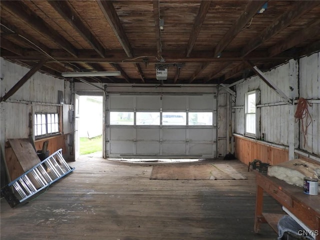 23 Paul St, Auburn, NY 13021 - garage with a garage door opener and wooden walls