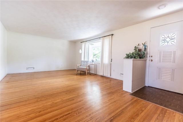 foyer entrance featuring wood finished floors