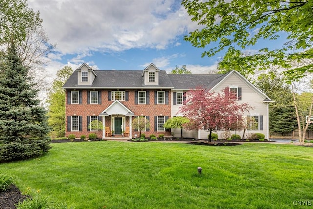 4314 Arbutus Dr, Pompey, NY 13104 - view of front of house featuring brick siding and a front lawn