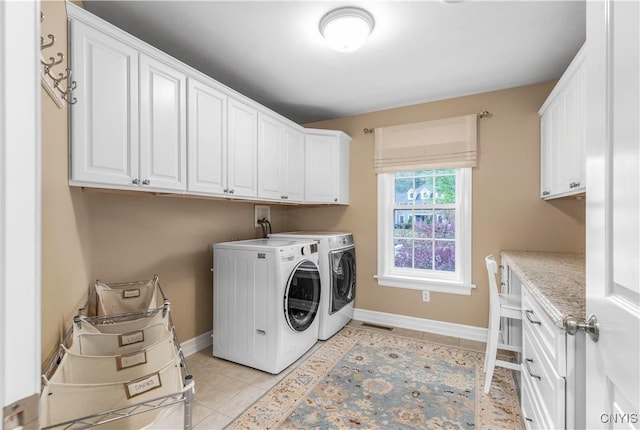 4314 Arbutus Dr, Pompey, NY 13104 - laundry room with cabinet space, separate washer and dryer, light tile patterned floors, and baseboards