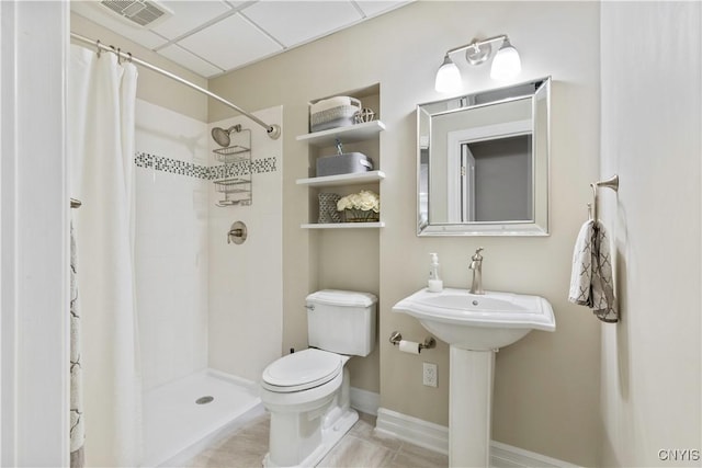 4314 Arbutus Dr, Pompey, NY 13104 - full bathroom featuring toilet, tiled shower, tile patterned floors, and baseboards