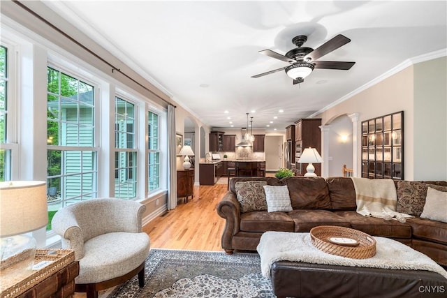 4314 Arbutus Dr, Pompey, NY 13104 - living area featuring crown molding, light wood-type flooring, a ceiling fan, decorative columns, and recessed lighting